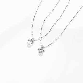 Zircon Bow Pearl Pendant Necklace – White Pearl / Tahitian Gray Pearl